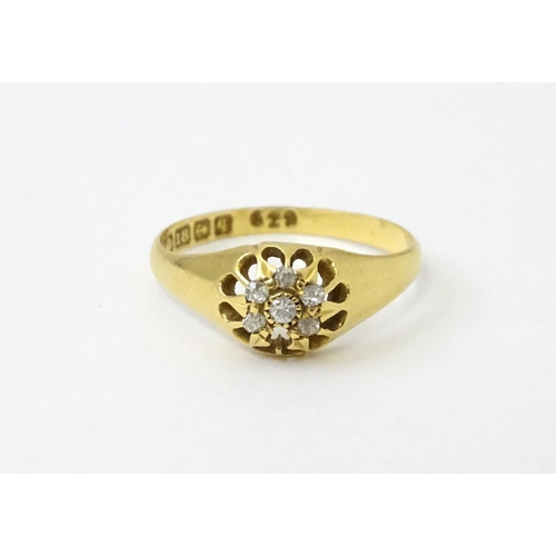 745A - An 18ct gold ring set with 6 diamonds. Ring size approx L