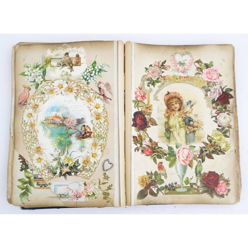 2118 - A large Victorian scrapbook to include various newspaper and magazine clippings, greetings cards, ci... 