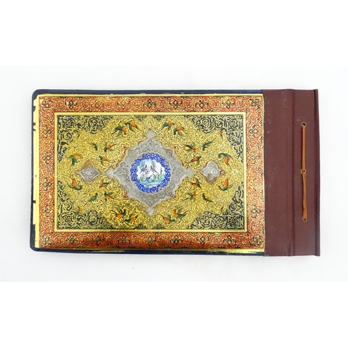 2122 - A Persian photograph album with lacquered boards, one decorated with an enamel panel depicting birds... 