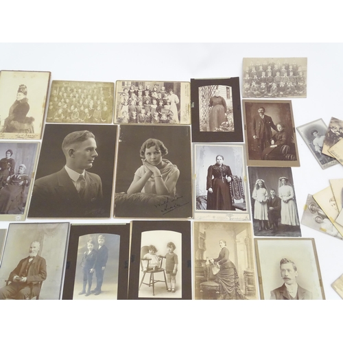 2144 - A quantity of assorted 19thC and later studio photograph cards / carte de visite type photographs to... 