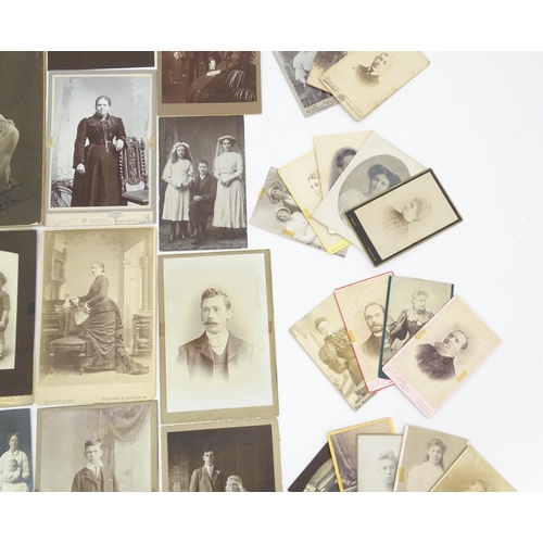 2144 - A quantity of assorted 19thC and later studio photograph cards / carte de visite type photographs to... 