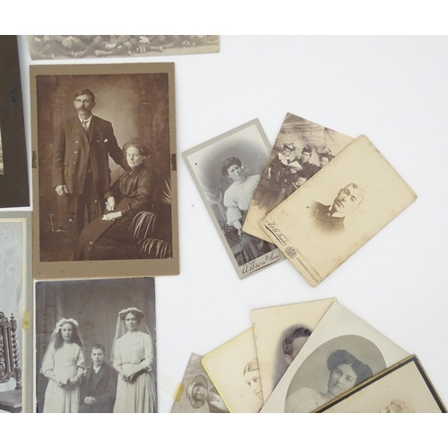 2144 - A quantity of assorted 19thC and later studio photograph cards / carte de visite type photographs to... 