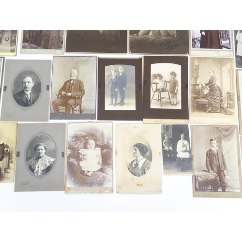 2144 - A quantity of assorted 19thC and later studio photograph cards / carte de visite type photographs to... 