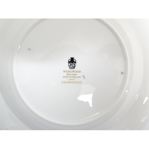 170A - A quantity of Wedgwood dinner wares in the Charnwood pattern to include plates, twin handles soup bo... 