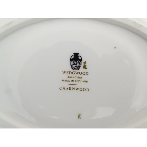 170A - A quantity of Wedgwood dinner wares in the Charnwood pattern to include plates, twin handles soup bo... 