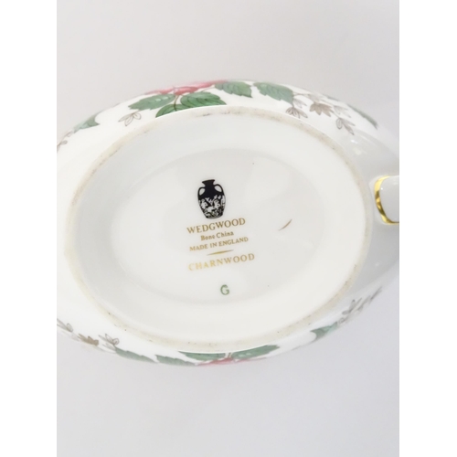 170A - A quantity of Wedgwood dinner wares in the Charnwood pattern to include plates, twin handles soup bo... 