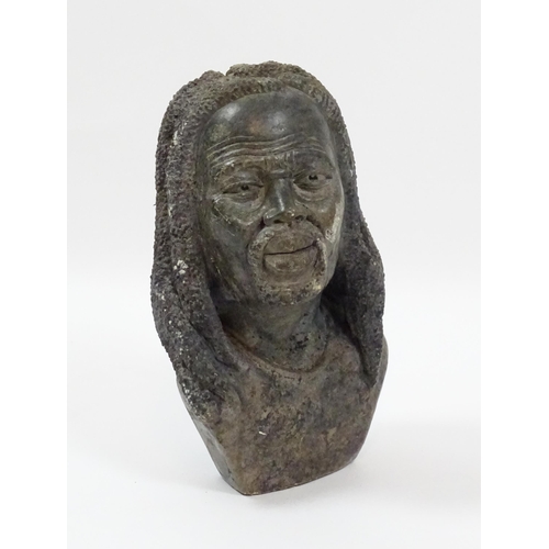 1150 - Ethnographic / Native / Tribal : An African carved soapstone bust modelled as a man with dreadlocks.... 