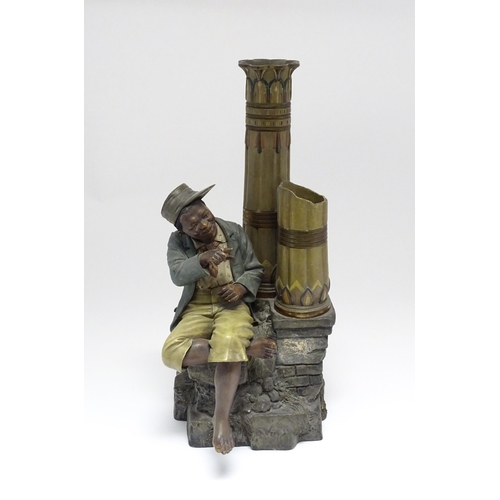 137 - A late 19thC terracotta figure of a boy with decorative columns, having polychrome decoration, by Jo... 