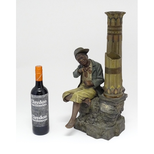 137 - A late 19thC terracotta figure of a boy with decorative columns, having polychrome decoration, by Jo... 