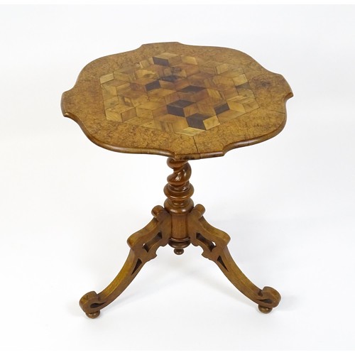 1490 - A 19thC tripod table with a burr amboyna veneered top surrounding a central parquetry style sample w... 