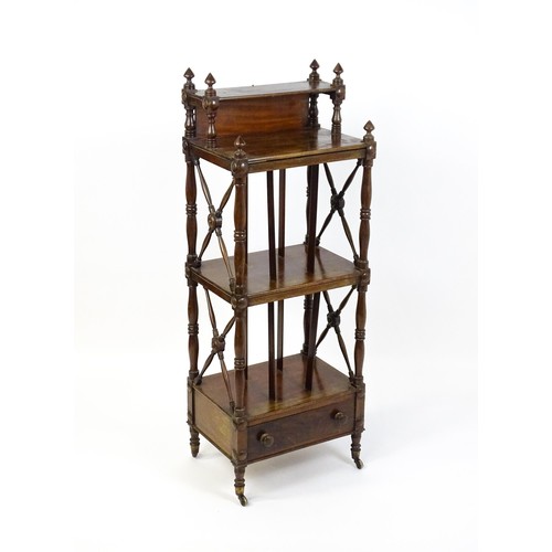 1492 - An early 19thC mahogany whatnot Canterbury surmounted by turned uprights and a small shelf above thr... 