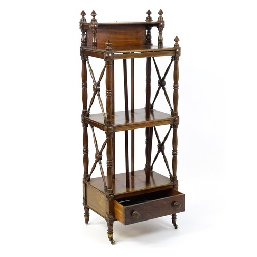 1492 - An early 19thC mahogany whatnot Canterbury surmounted by turned uprights and a small shelf above thr... 