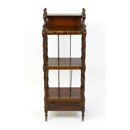 1492 - An early 19thC mahogany whatnot Canterbury surmounted by turned uprights and a small shelf above thr... 