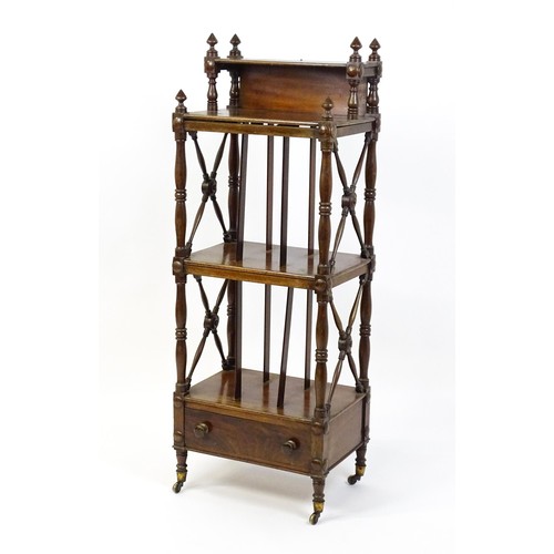 1492 - An early 19thC mahogany whatnot Canterbury surmounted by turned uprights and a small shelf above thr... 