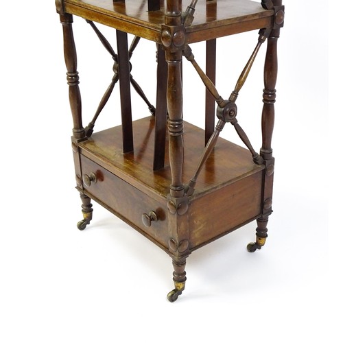 1492 - An early 19thC mahogany whatnot Canterbury surmounted by turned uprights and a small shelf above thr... 