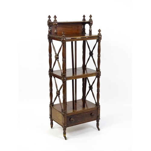 1492 - An early 19thC mahogany whatnot Canterbury surmounted by turned uprights and a small shelf above thr... 