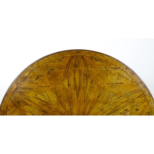 1493 - A 19thC dining table with an olive wood veneered circular top raised on a rosewood pedestal with aca... 