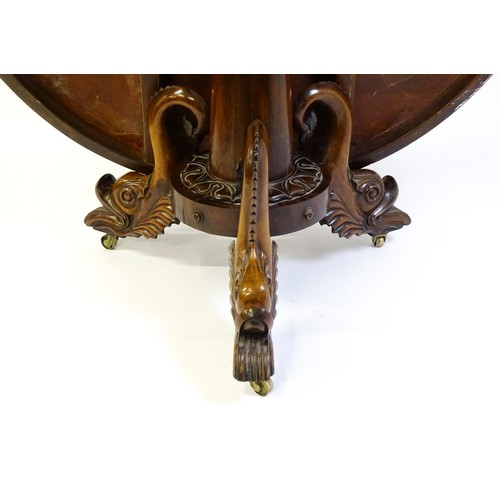 1493 - A 19thC dining table with an olive wood veneered circular top raised on a rosewood pedestal with aca... 