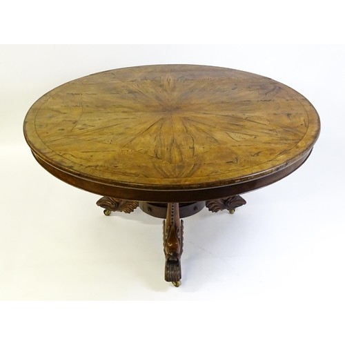 1493 - A 19thC dining table with an olive wood veneered circular top raised on a rosewood pedestal with aca... 