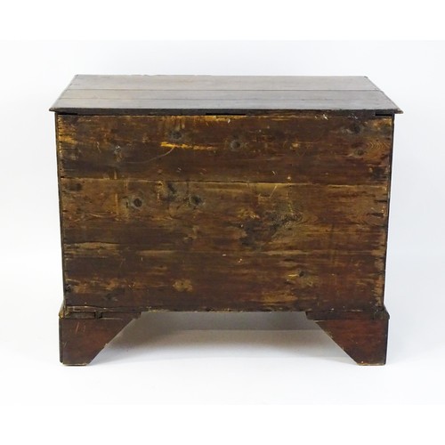 1510 - An early / mid 18thC oak kneehole desk with a moulded top above two short drawers and two banks of f... 