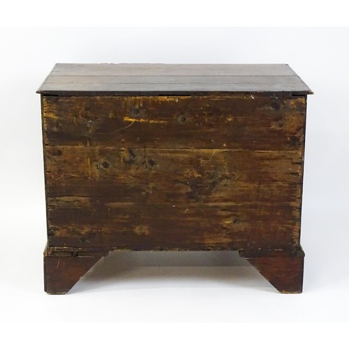 1510 - An early / mid 18thC oak kneehole desk with a moulded top above two short drawers and two banks of f... 