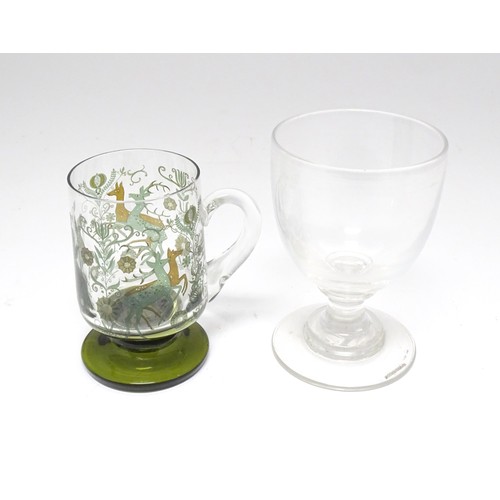 196 - A 19thC glass goblet / rummer. Together with a Continental tankard depicting hunting scene, figure o... 