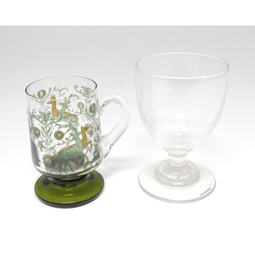 196 - A 19thC glass goblet / rummer. Together with a Continental tankard depicting hunting scene, figure o... 