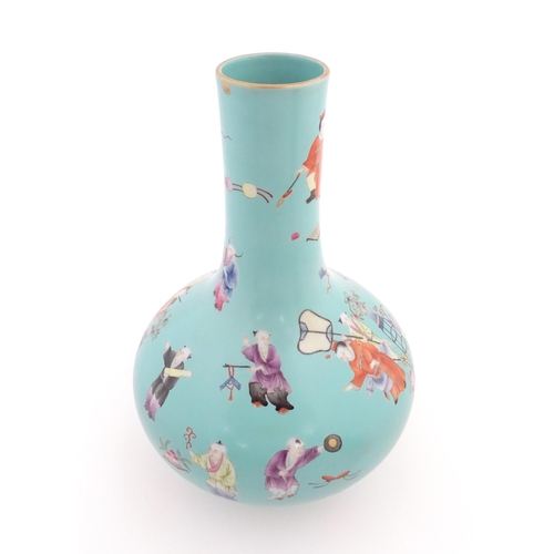 6 - A Chinese famille rose vase with a turquoise ground decorated with figures and auspicious symbols. C... 