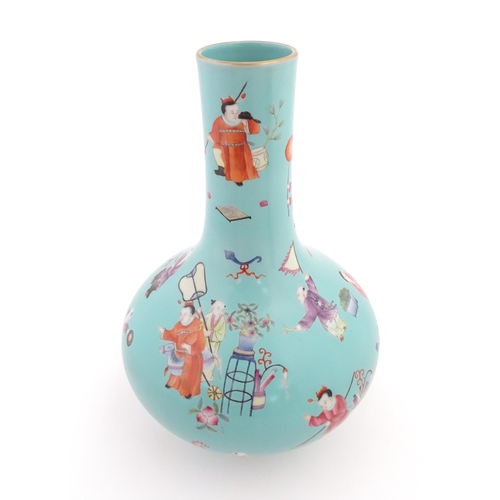 6 - A Chinese famille rose vase with a turquoise ground decorated with figures and auspicious symbols. C... 