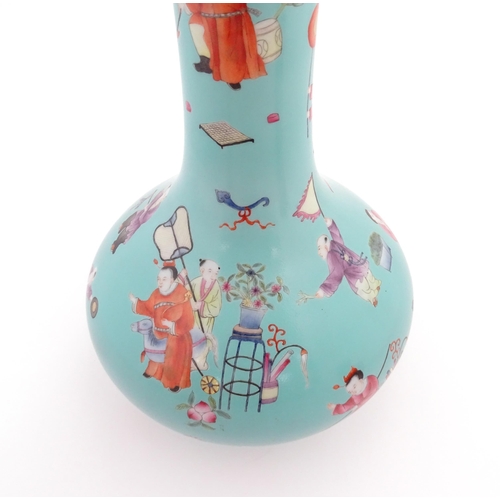 6 - A Chinese famille rose vase with a turquoise ground decorated with figures and auspicious symbols. C... 