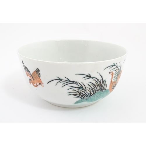 20 - A Chinese bowl decorated with geese in a landscape. Character marks under. Approx. 2 3/4