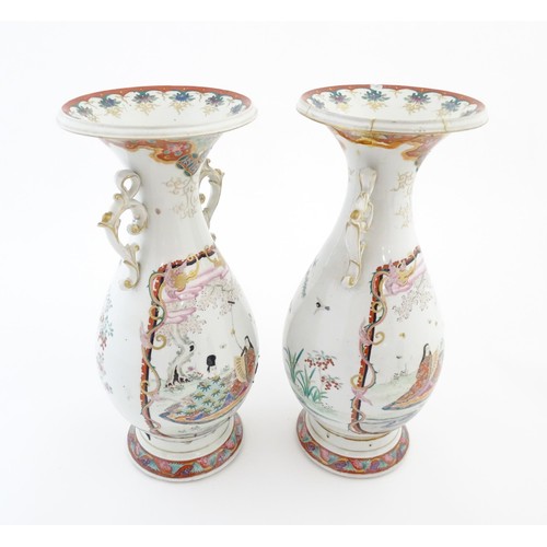 24 - A pair of Japanese vases with flared rim and twin handles, decorated with a vignette depicting figur... 