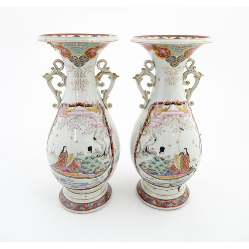 24 - A pair of Japanese vases with flared rim and twin handles, decorated with a vignette depicting figur... 