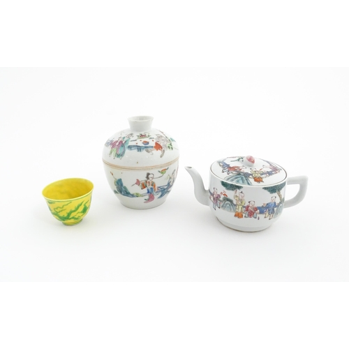 39 - Three Chinese items comprising a famille rose pot and cover decorated with figures, a teapot decorat... 