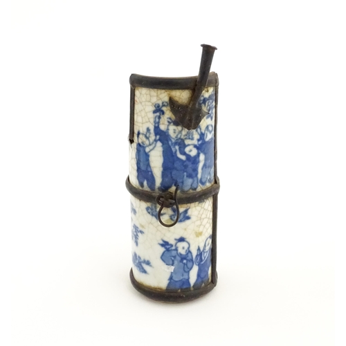 50A - Three Chinese items comprising a cricket box decorated with a figure, flowers and Character script, ... 