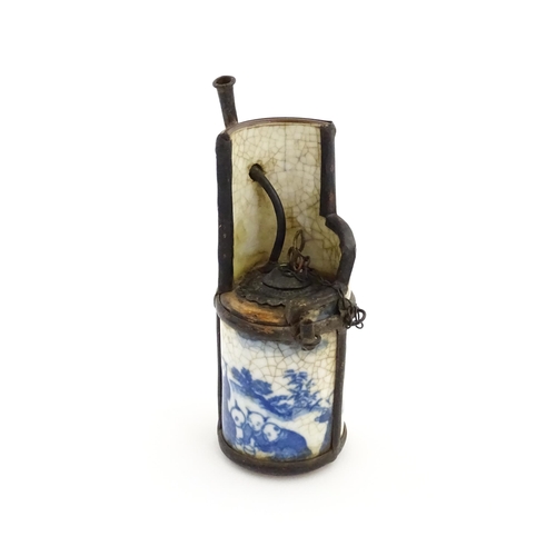 50A - Three Chinese items comprising a cricket box decorated with a figure, flowers and Character script, ... 