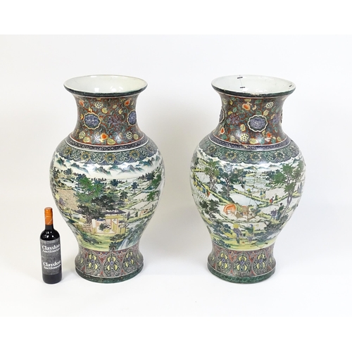 51 - A pair of large Chinese famille verte vases decorated with farming scenes with figures harvesting fi... 