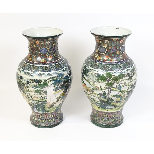 51 - A pair of large Chinese famille verte vases decorated with farming scenes with figures harvesting fi... 