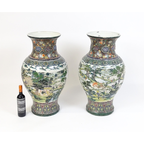 51 - A pair of large Chinese famille verte vases decorated with farming scenes with figures harvesting fi... 