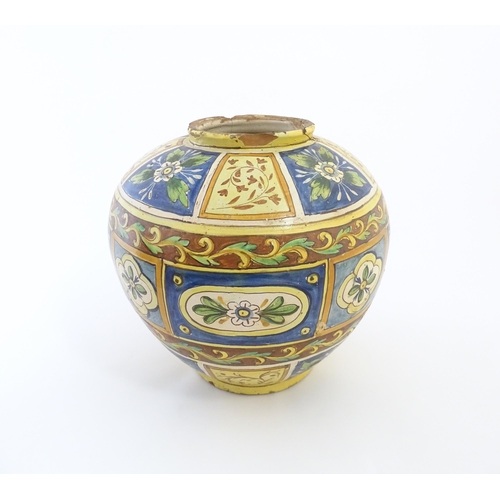 141 - A Sicilian maiolica Bombola vase with panelled and banded decoration depicting flowers and foliage. ... 