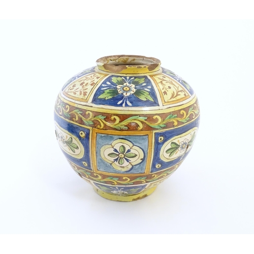 141 - A Sicilian maiolica Bombola vase with panelled and banded decoration depicting flowers and foliage. ... 