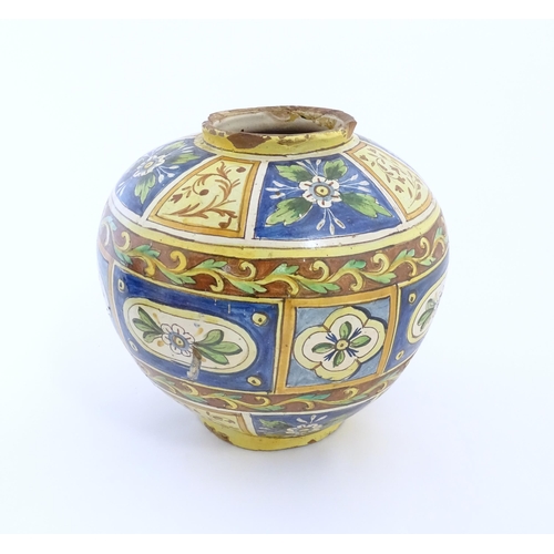 141 - A Sicilian maiolica Bombola vase with panelled and banded decoration depicting flowers and foliage. ... 