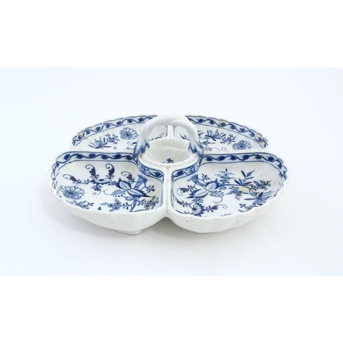 142 - A Continental blue and white hors d'oeuvre dish decorated in the Onion pattern with four sections an... 