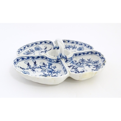 142 - A Continental blue and white hors d'oeuvre dish decorated in the Onion pattern with four sections an... 