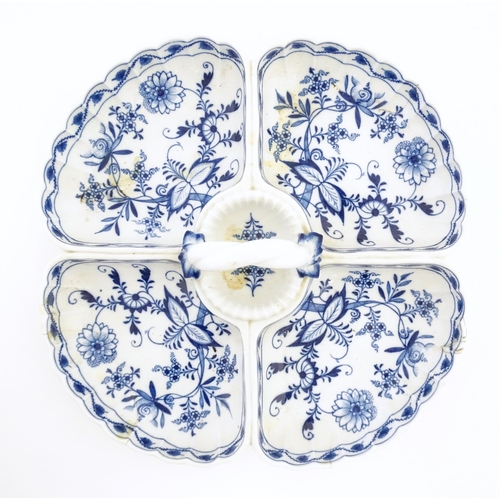 142 - A Continental blue and white hors d'oeuvre dish decorated in the Onion pattern with four sections an... 