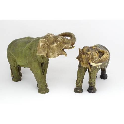 143 - Two large Royal Dux models of elephants. The smaller elephant with pink triangle mark and numbered 8... 