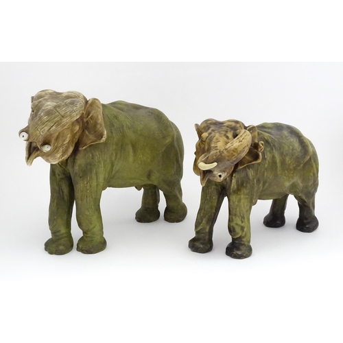 143 - Two large Royal Dux models of elephants. The smaller elephant with pink triangle mark and numbered 8... 