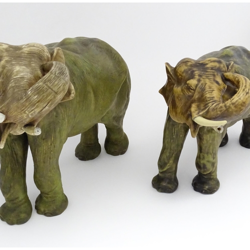 143 - Two large Royal Dux models of elephants. The smaller elephant with pink triangle mark and numbered 8... 