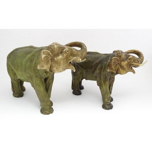 143 - Two large Royal Dux models of elephants. The smaller elephant with pink triangle mark and numbered 8... 