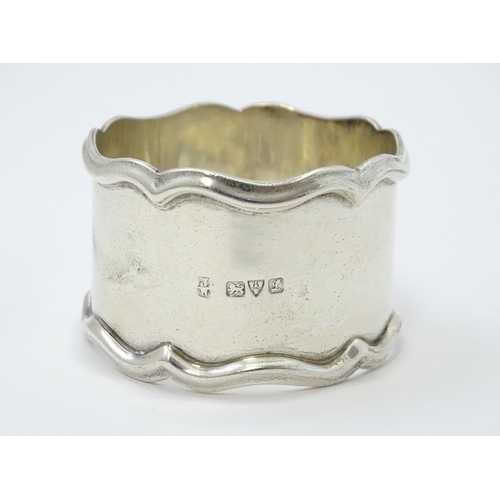 335 - Seven assorted silver napkin rings, various dates and makers to include an Art Deco example hallmark... 